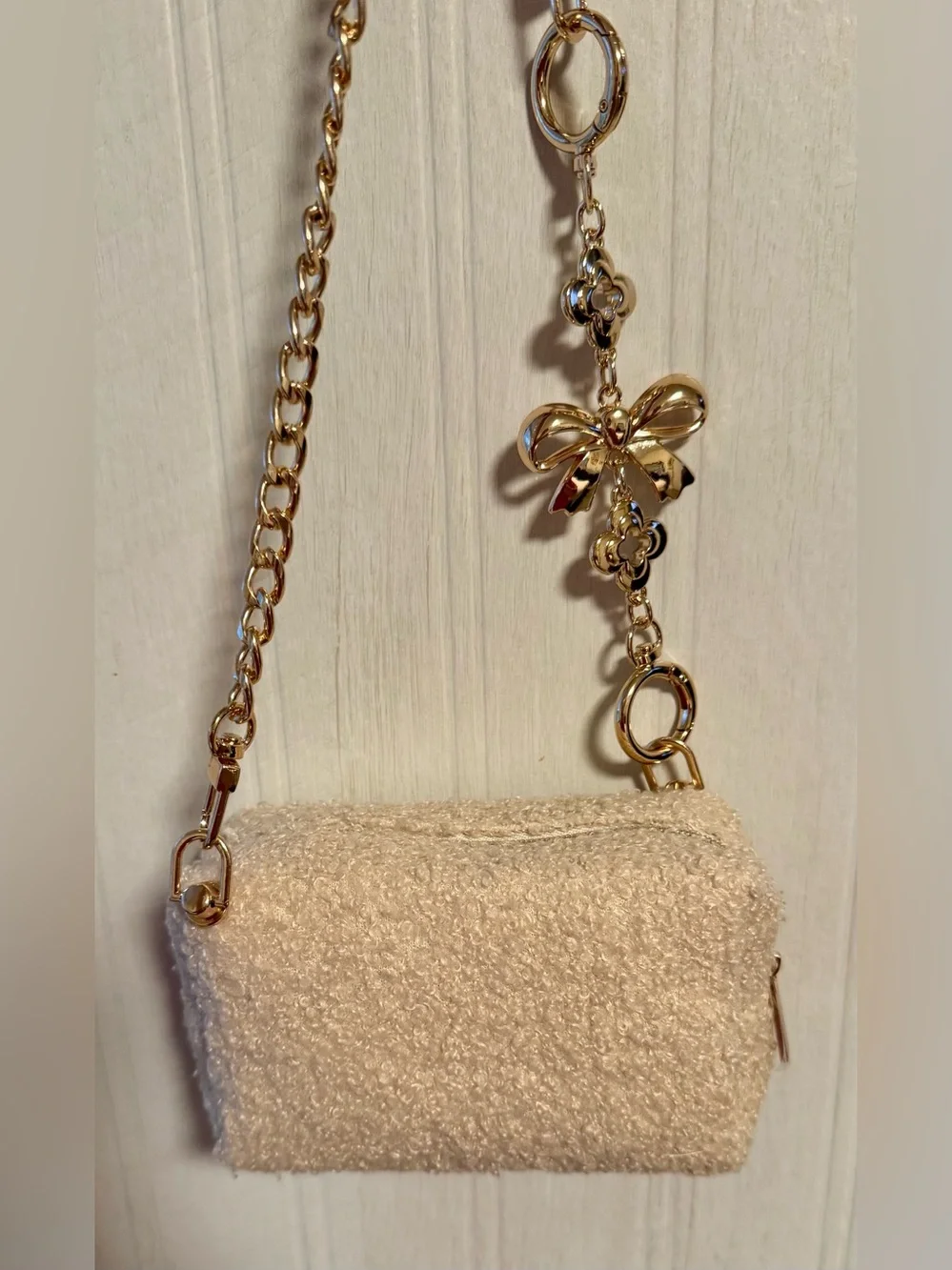 Yves Saint Laurent beaute Cream shearling pouch with gold hardware